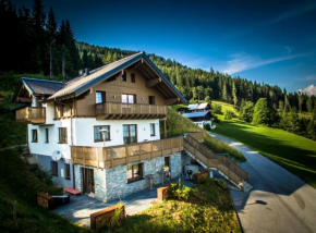 Отель Aigenberg Appartements, Флахау